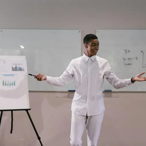 Analytics and Reporting Insights – Stellar Digital Media Professional presenting marketing analytics charts and performance data on a flipchart, representing Stellar Digital Media analytics and reporting services.