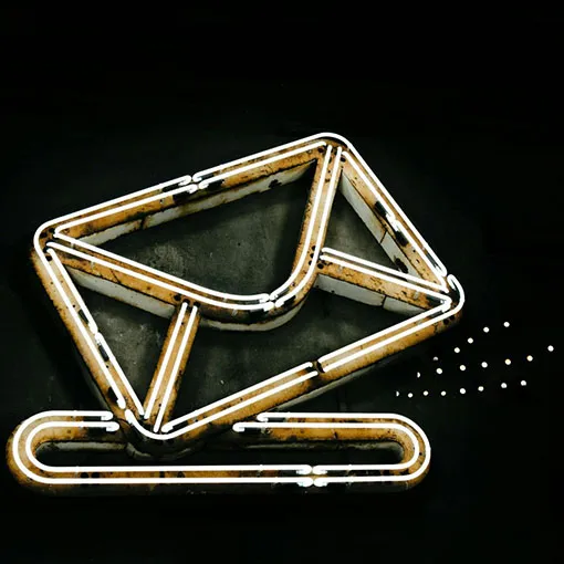 Neon email icon symbolising digital communication and marketing campaigns