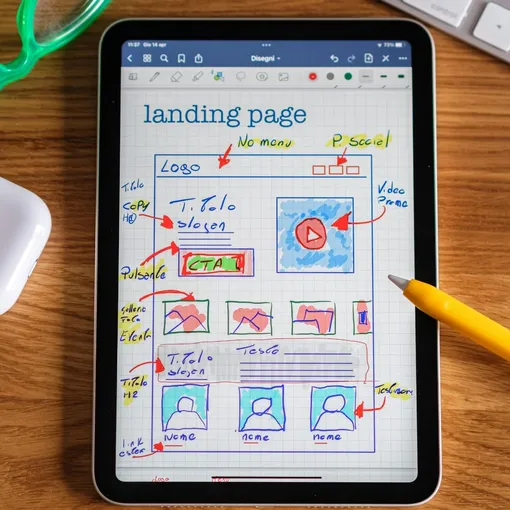 Framer landing page wireframe concept Tablet with colourful landing page wireframe sketch showing layout and call to action planning for a Framer website