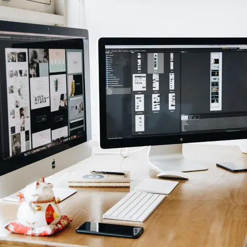 Squarespace Website Design and Development Workspace Dual monitor workspace showing Squarespace website design layouts on screen