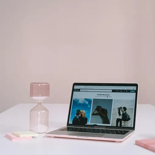 Laptop on desk displaying photography website, representing Wix development and professional website support.