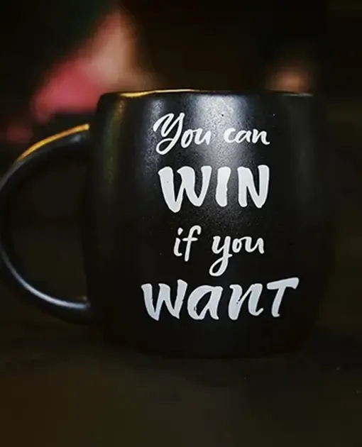 Black coffee mug with motivational quote “You can win if you want” symbolising Stellar Digital Media’s SEO services New Zealand helping businesses achieve measurable growth